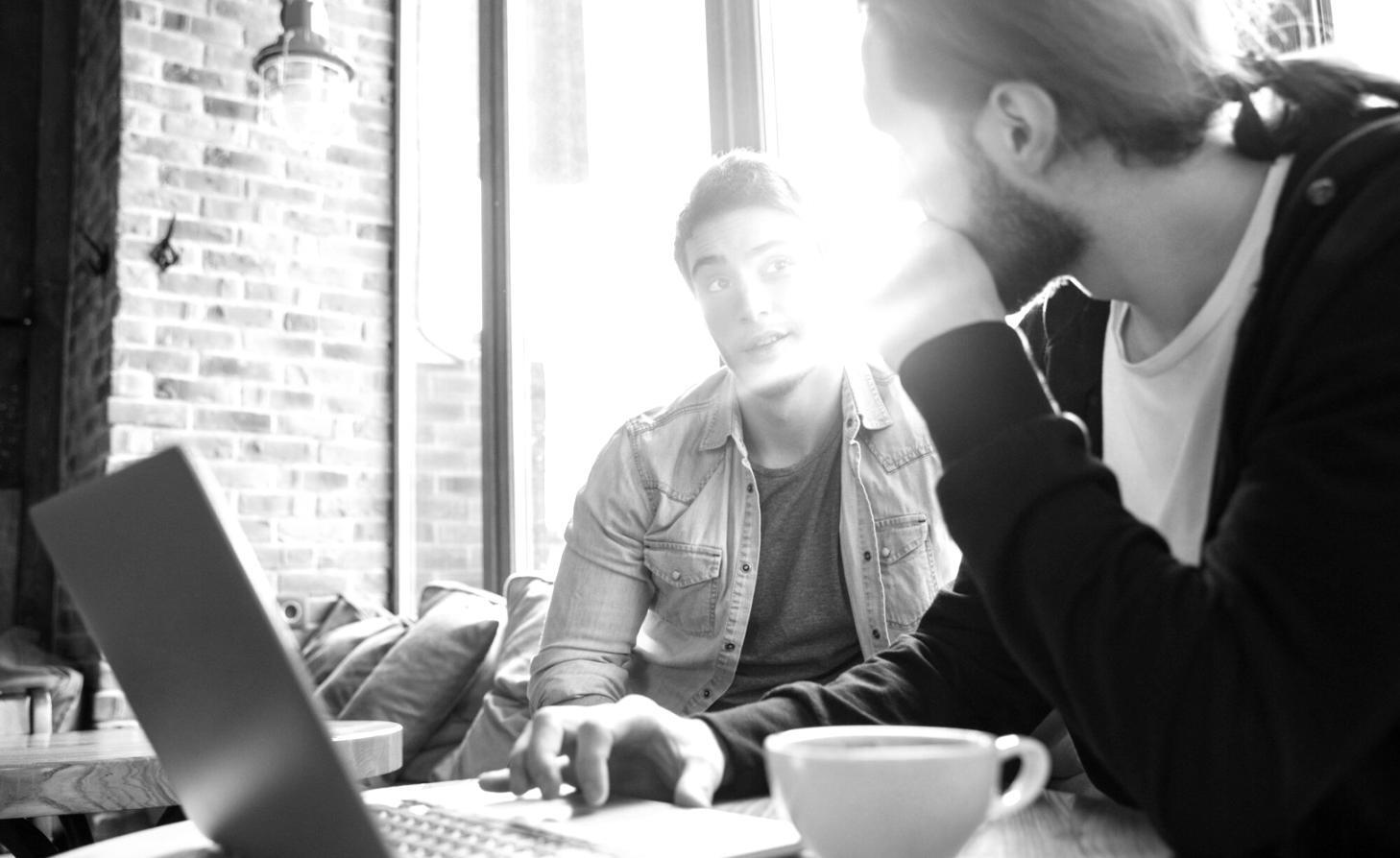 Students learning budget management techniques in modern classroom setting